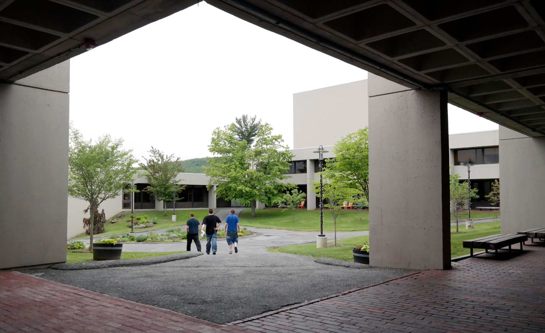 Three people walking on college campus (copy)